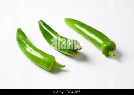 Green Chili Peppers on a White Background Stock Photo