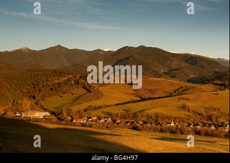 Kvacany village, Liptov, Slovakia, in autumn sunset wtih West Tatras sierra in background Stock Photo