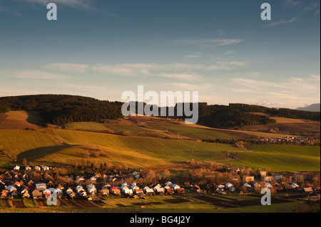 Kvacany village, Liptov, Slovakia, in autumn sunset wtih West Tatras sierra in background, Liptov, Slovakia in sutumn sunset Stock Photo
