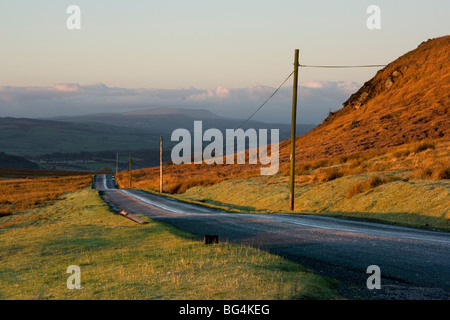 Morning sunshine on Embsay Moor, North Yorkshire, with a view in the distance of Pendle Hill Stock Photo