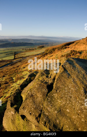 Morning sunshine on Embsay Moor, North Yorkshire, with a view in the distance of Pendle Hill Stock Photo