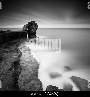 Pulpit Rock, Portland Bill, Dorset, UK, with waves swirling on the rocks below Pulpit Rock, Portland Bill, Dorset, UK, with waves swirling on the rocks below