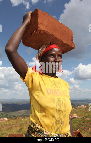 During the war in Burundi half a million people fled to Tanzania.Now they return ands rebuild their homes Stock Photo