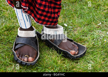 Maasai Warrior from the Tanzanian village of Eluai visit 'Farming World' in Kent. The warriors shoes are made from old tyres Stock Photo
