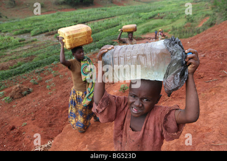 During the war in Burundi half a million people fled to Tanzania.Now they return ands rebuild their homes Stock Photo