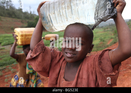 During the war in Burundi half a million people fled to Tanzania.Now they return ands rebuild their homes Stock Photo