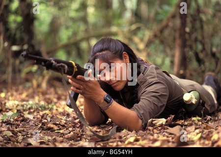 Woman guerrilla with rifle in the Ixcan jungle of Guatemala Stock Photo