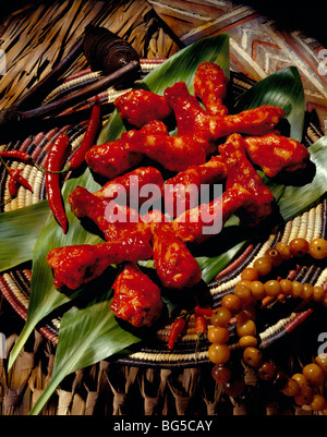 Spicy chicken drumsticks on leaves Stock Photo