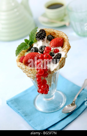Crepes with berries and yogurt. Recipe available. Stock Photo