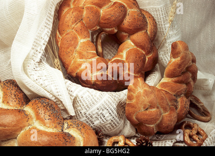 closeup with bread and pretzel in basket, grain and cone Stock Photo