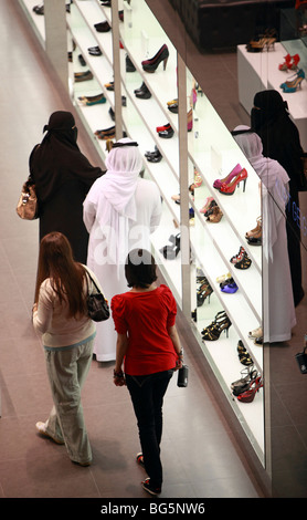 People in a shoeshop in the Mall of Dubai, United Arab Emirates Stock Photo