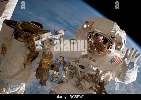 Astronaut Clay Anderson during spacewalk working on International Space Station Stock Photo