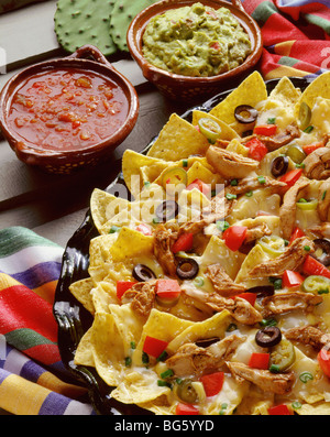 Chicken fajita nachos with gaucamole and salsa Stock Photo