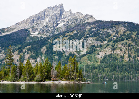 Teewinot Mountain above kayakers on Jenny Lake. Grand Tetons National Park, Wyoming, USA. Stock Photo