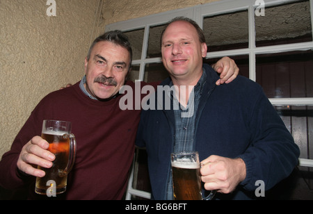 2 drunk men in bar Stock Photo