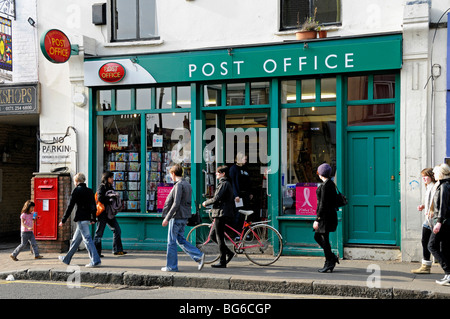 Post Office with people walking past Stoke Newington Church Street London England UK Stock Photo