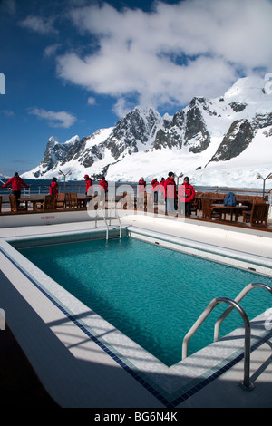 m/v Minerva cruise ship passengers on the deck, cruising through the Lemaire Channel, Antarctica Stock Photo