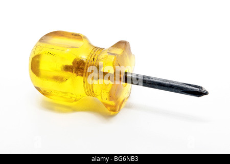 A stub screw driver with a yellow handle isolated on white Stock Photo