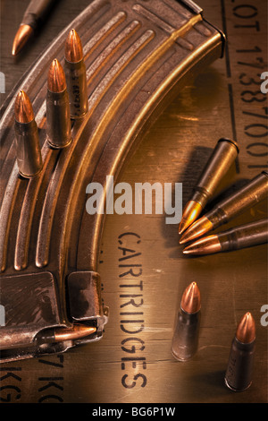 AK-47 clip, ammunition crate and assault rifle cartridges Stock Photo