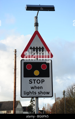 Road sign at railway level crossing Stock Photo