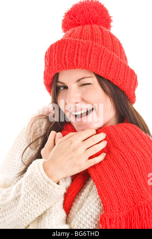 Woman wearing red scarf and cap winking isolated on white background Stock Photo