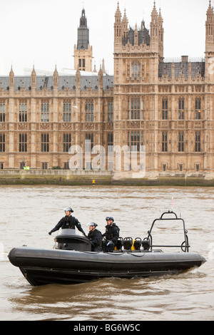 Police boat protecting parliament from a climate change march in London Stock Photo