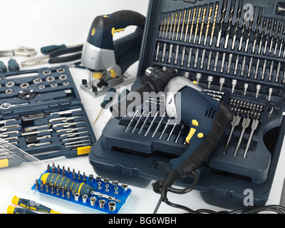 Electric drill, a jigsaw, thread cutting dies and taps, drill bits and other tools Stock Photo