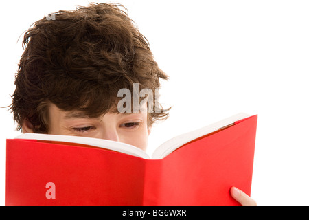 Teenage boy reading book isolated on white background Stock Photo