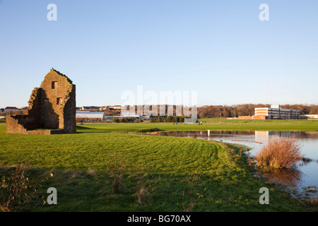 Auchenharvie Golf Course in Stevenston, looking over a water feature to Auchanharvie Academy and Harvie's Leisure Centre. Stock Photo