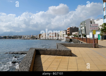 A fine view from the pier along the Avenida del Molino at the coastline of the small coastal town of Arinaga on the south coast Stock Photo