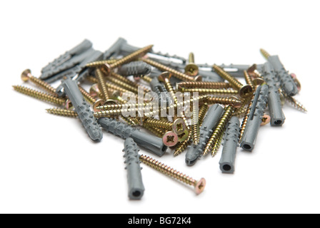 Screws and dowels on white background Stock Photo