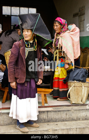 Yi women in traditional dress at Friday market, Shaxi, Jiangsu,, China Stock Photo