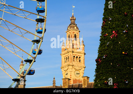 Lille, Pas de Calais, France. Ferris wheel, Town Hall tower and Christmas Tree at the Christmas Market Stock Photo