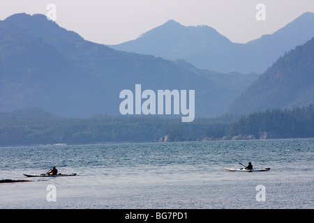 Visitors paddle kayaks in the Broken Group Islands of Pacific Rim National Park on the west coast of Vancouver Island, Canada. Stock Photo