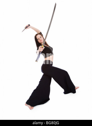 Aggressive Postures Beautiful woman in an aggressive posture with a sword on a white Stock ...