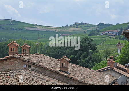 Clay tiled roofs and views of the vineyards around Barolo castle Langhe Piedmont Italy