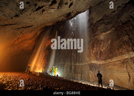 Looking across the main chamber of Gaping Gill during a public winch meet, where the general public can visit the cave. Stock Photo