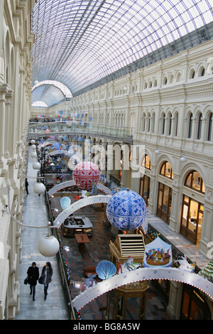 Inside view of shopping gallery in Moscow decorated for Christmas: Moscow State Department Store (GUM) located at Red square Stock Photo