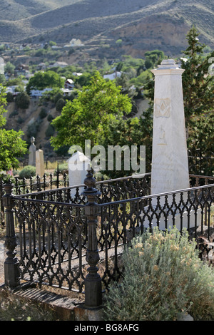 Tombstones at Silver Terrace Cemeteries, circa 1800s. Virginia City, Nevada. Town in the background. Stock Photo