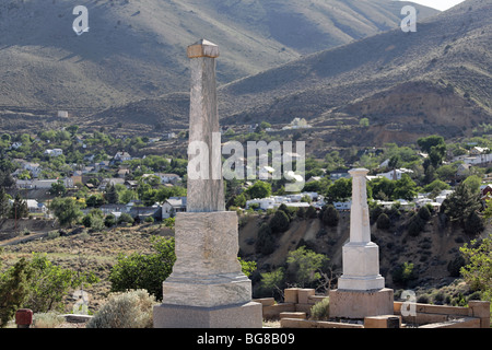 Tombstones at Silver Terrace Cemeteries, circa 1800s. Virginia City, Nevada. Town in the background. Stock Photo