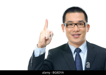 Portrait of a businessman pointing upwards Stock Photo