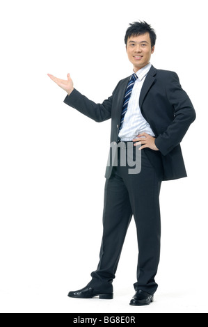 Businessman giving presentation against a white background Stock Photo