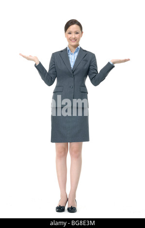 Businesswoman showing OK sign Stock Photo