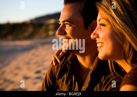 Young couple, side profile portrait on the beach, La Jolla, California Stock Photo