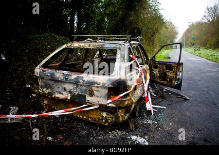 Burned out Vauxhall Astra. Stolen Car burnt out by joyriders Stock Photo