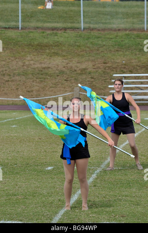 Flag girls in the color guard of an American high school marching band ...