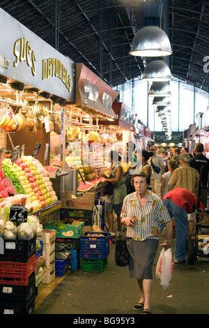 SENIOR, SHOPPING, MARKET, LAS RAMBLAS: A senior with shopping at Central Market stall stalls Mercado de Boqueria on Las Ramblas Barcelona Spain Stock Photo