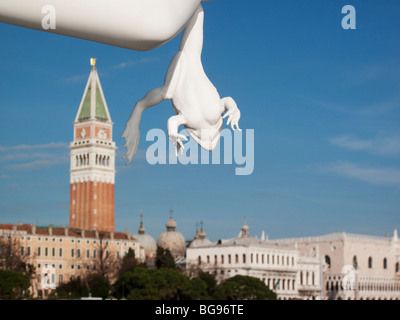 statue holding frog, Venice, Italy Stock Photo