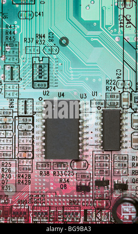 Abstract multi-color circuit board with electronic components Stock Photo
