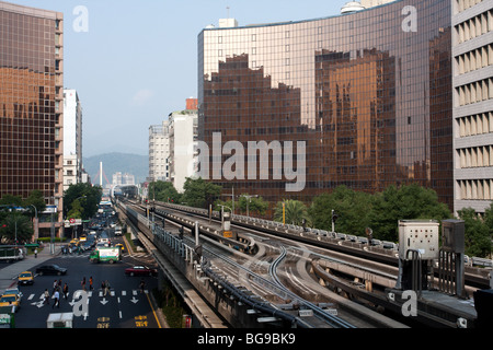 An Innovia APM 256 train traveling on elevated rails approaches the Zhongshan Junior High School station, in Taipei, Taiwan Stock Photo